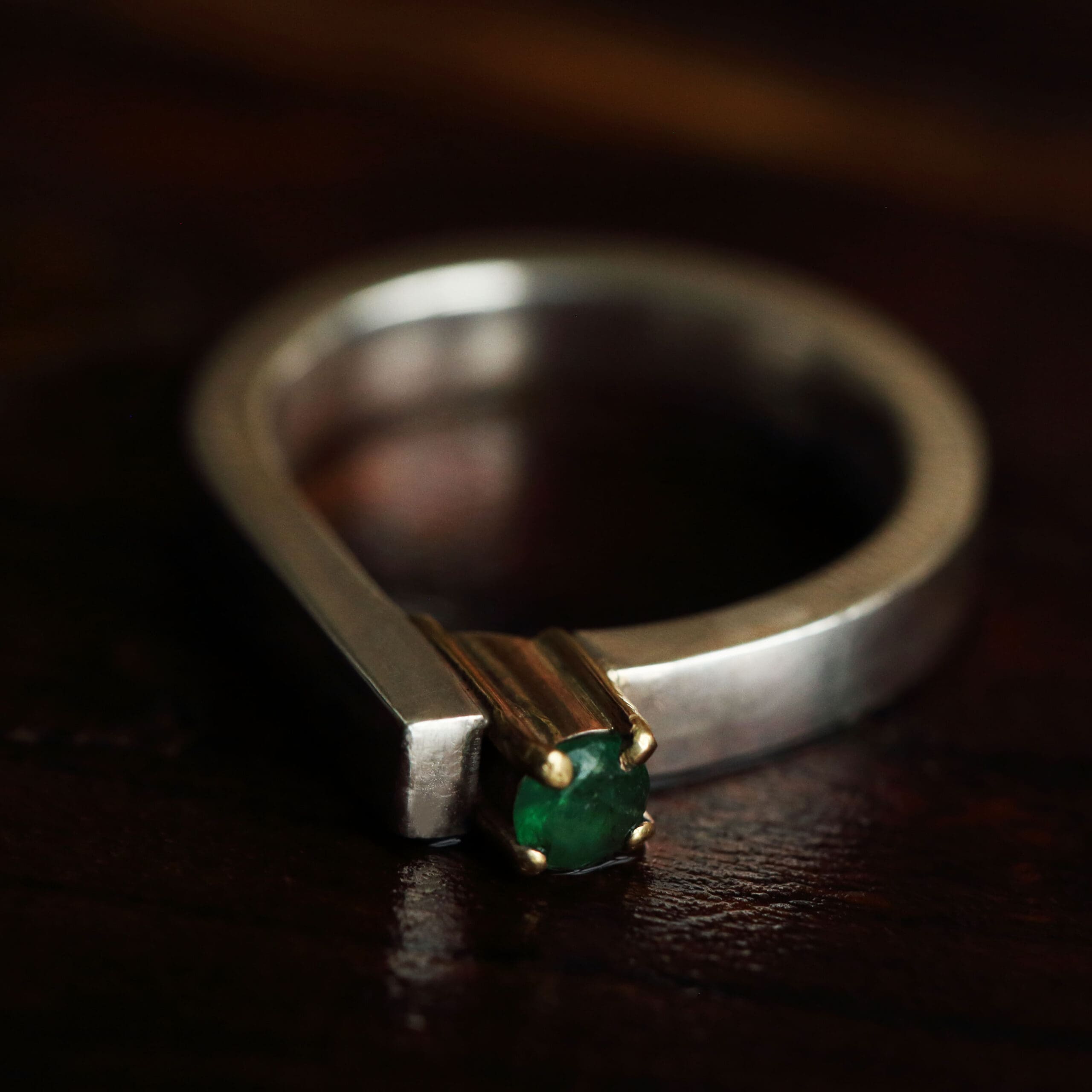 Emerald in gold and silver ring