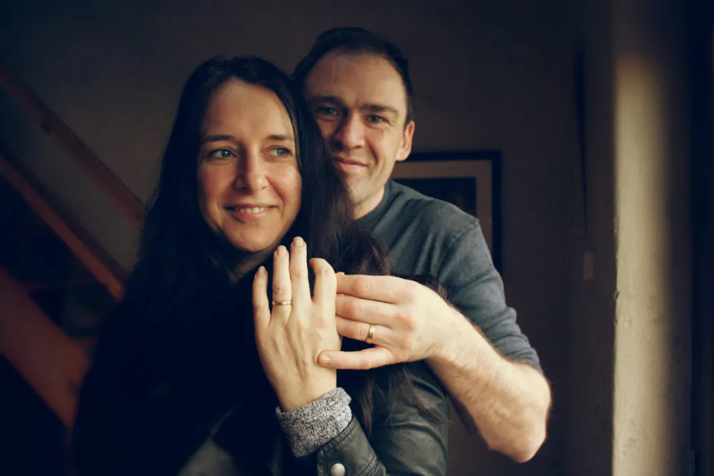 Newly weds showing of the rings they made themselves